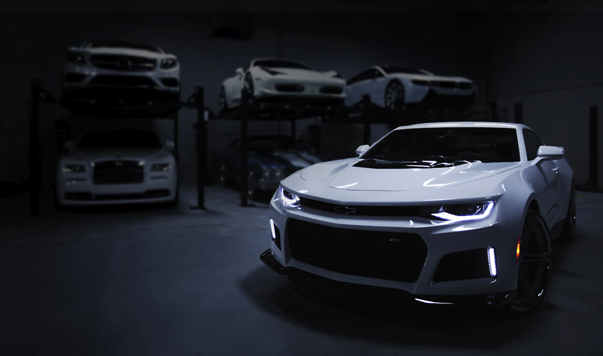 New cars in a dark dealership showroom