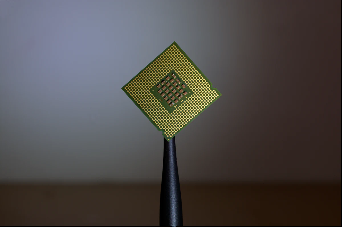 A computer processor chip held up to the light